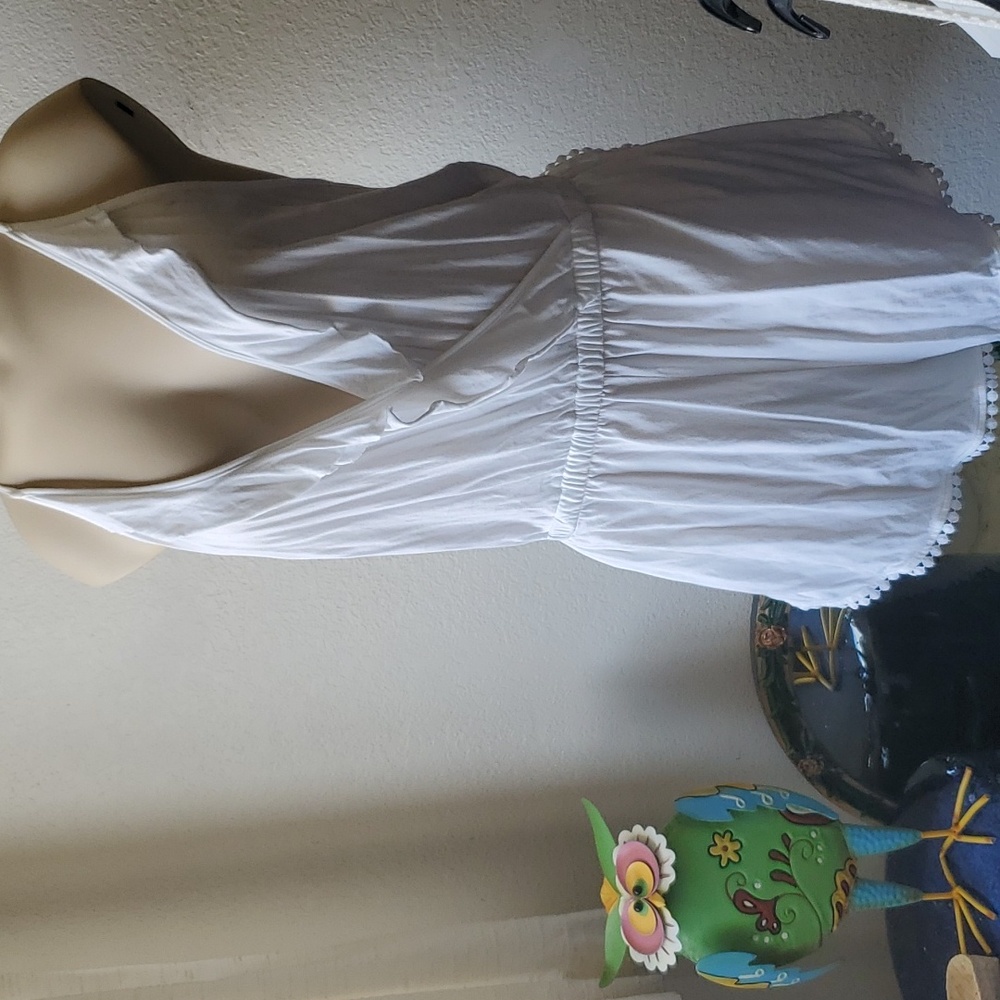 Romper NWOT with ruffle and trim. Topshop